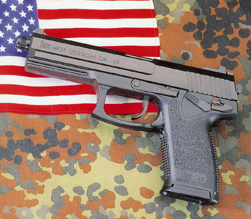 Military version of the Mark 23 that shows military slide markings.  Background shows the common heritage, American flag and German camouflage.